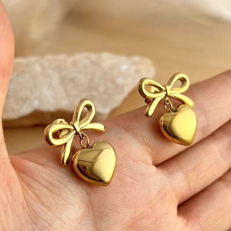 Gold Bow Drop Earrings with Dangling Heart Charm – Cute & Chic