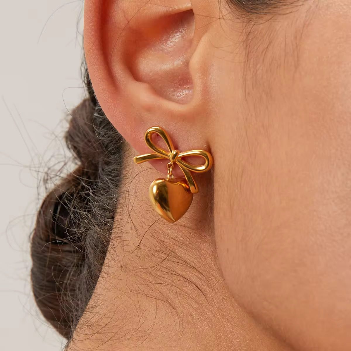 Gold Bow Drop Earrings with Dangling Heart Charm – Cute & Chic