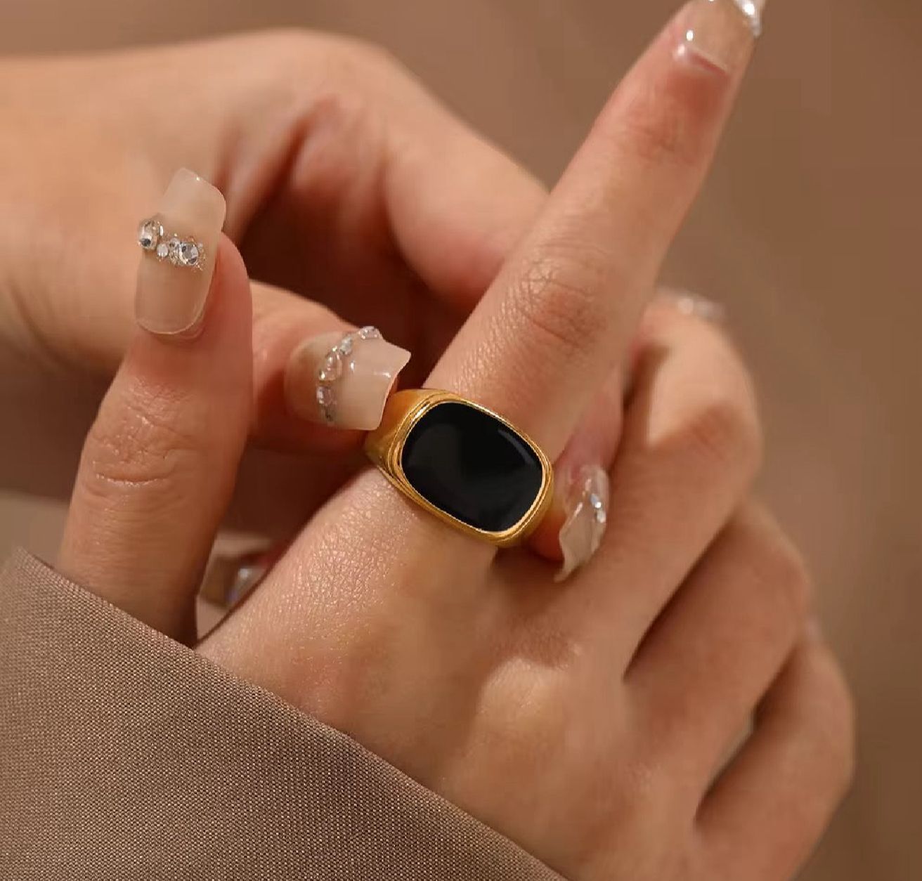 "Gold Ring with Black Stone"