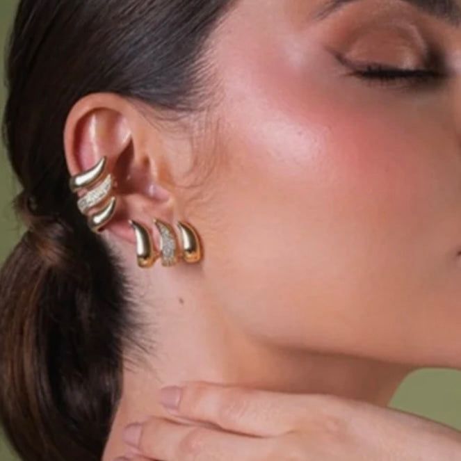 "Gold Wave Earrings with Crystals"