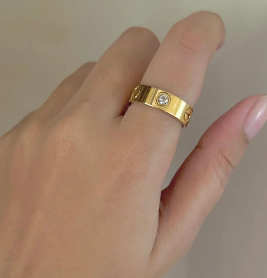 "Elegant Gold Cartier Ring with Diamond Accent 💎"